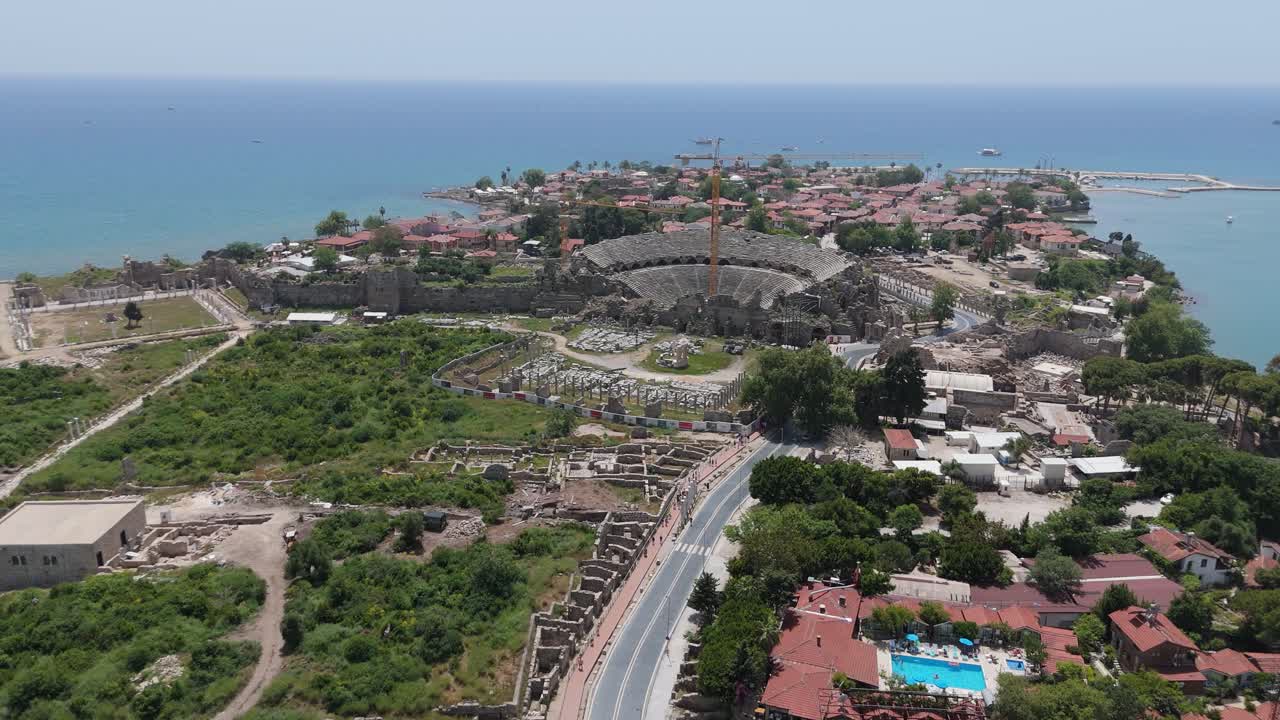 Aerial View Ruins of the Ancient City of Side in Antalya Province on the Mediterranean Coast. Old Statues in the State Agora. The Fragments of Ancient City Wall Bas Relief, Columns Antique Theater 4K