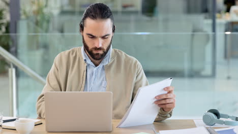 Trendy-business-man-reading-reports