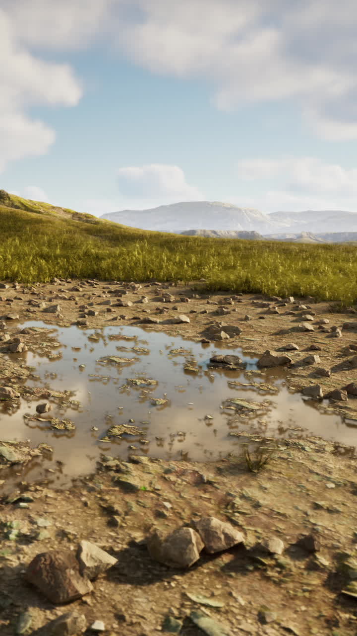 paisaje rural con charcos y colinas