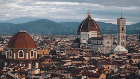 aerial circle right around florence duomo and san lorenzo basilica under cloudy sky