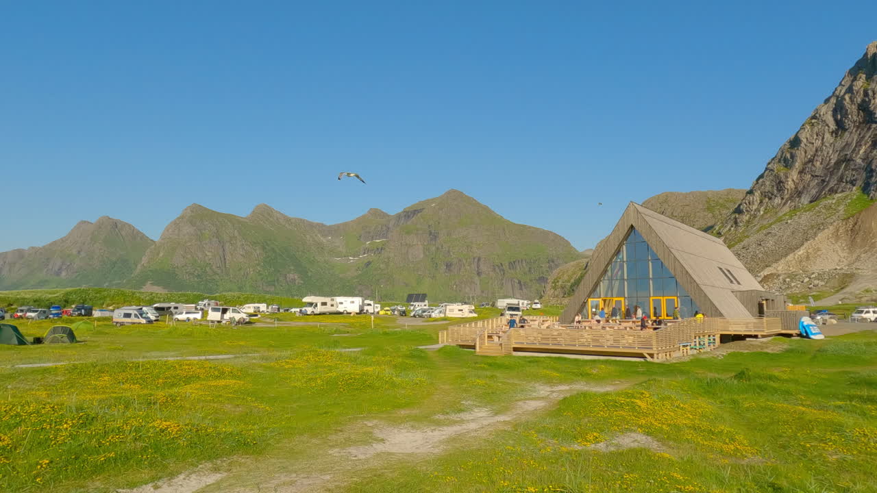 Panning shot of Lofoten Beach camp at Flakstad Beach, nice sunny summer day