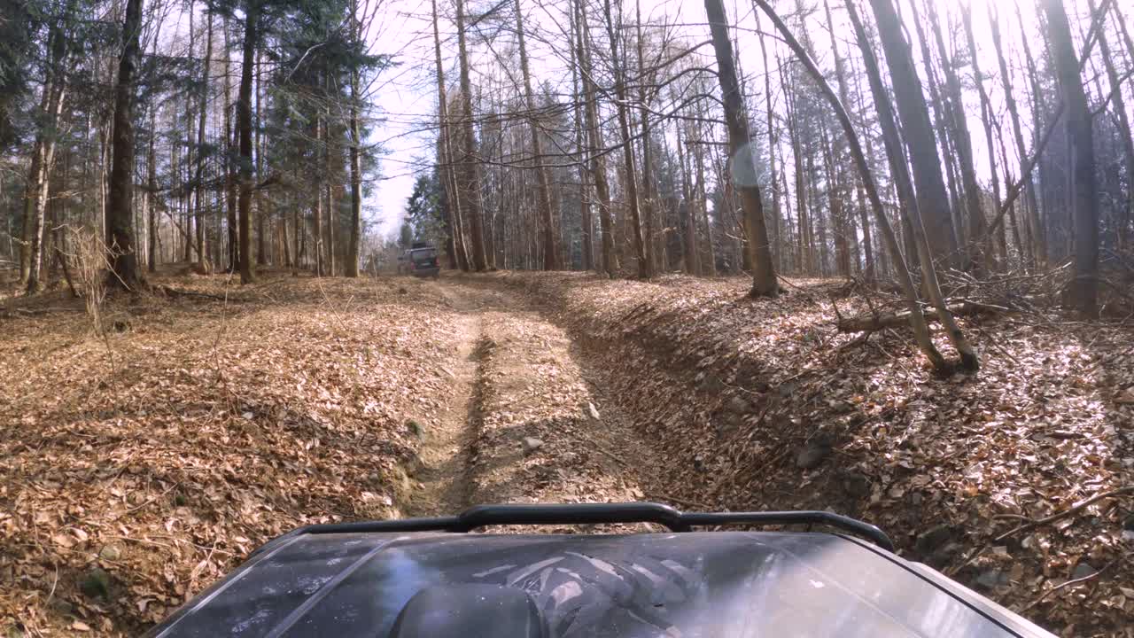 Off-road jeeps driving through stunning forest, mud, leafs and dirty road - GoPro 4k view