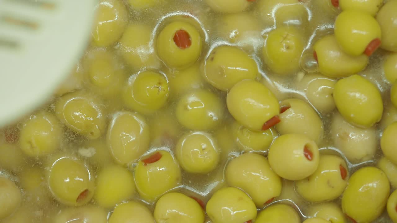 Close-up of Green Stuffed Olives in Brine