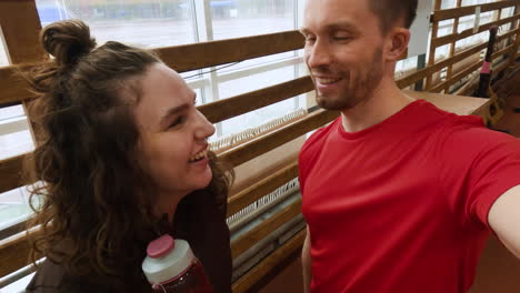 smiling people taking a selfie after a workout