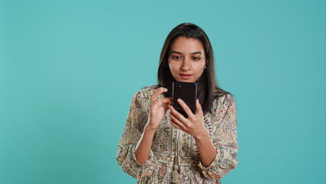 Portrait-of-woman-browsing-internet-websites,-exclaiming-in-astonishment