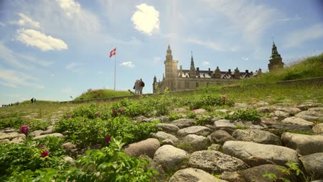 Kronborg-in-Helsingør,-Denmark,-home-of-Holger-Danske-and-Hamlet,-seen-from-the-rocks-on-the-beach