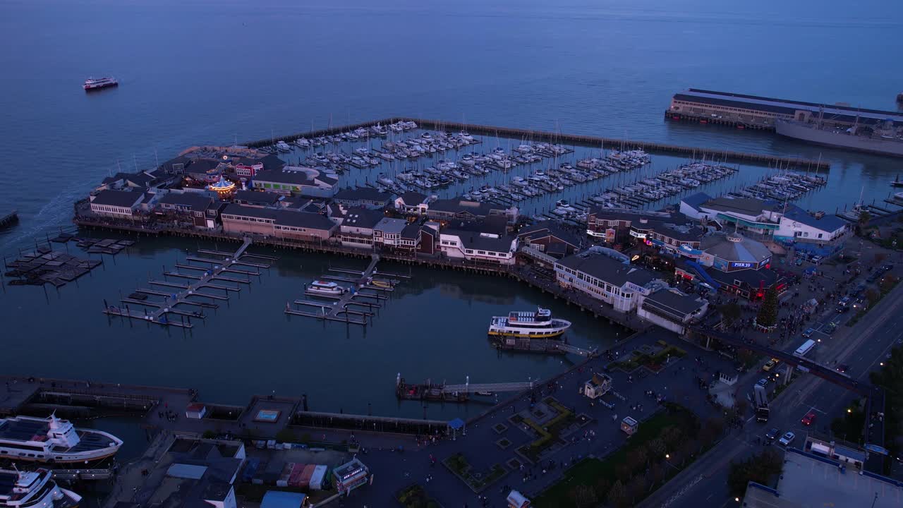 San Francisco, California USA. Aerial View of Pier 39, Marina Buildings and Twilight Traffic