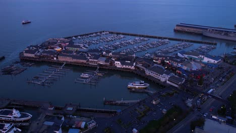 san francisco, california usa. aerial view of pier 39, marina buildings and twilight traffic