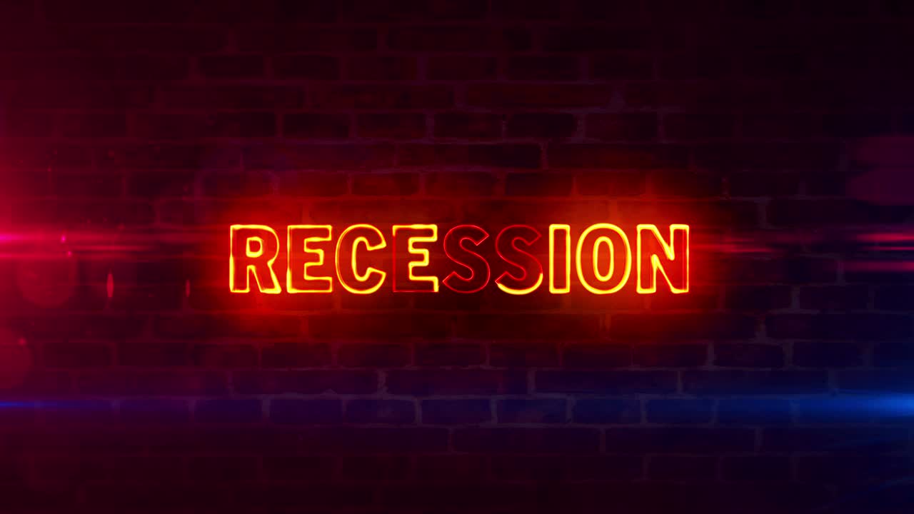 Recession economy and business neon on brick wall