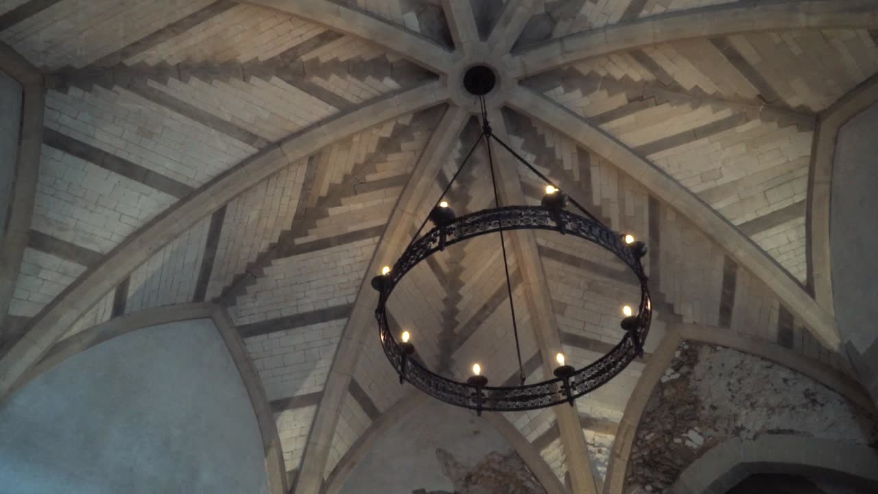 Ornate Ceiling and Chandelier in a Historic Building