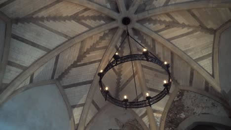 ornate ceiling and chandelier in a historic building
