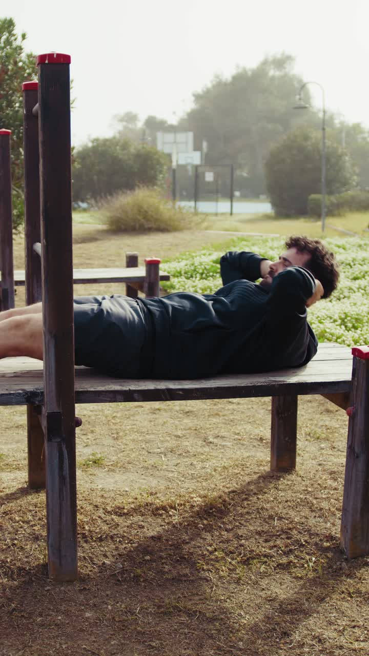 Sun Shines Strongly on a Man Working Out in the Park