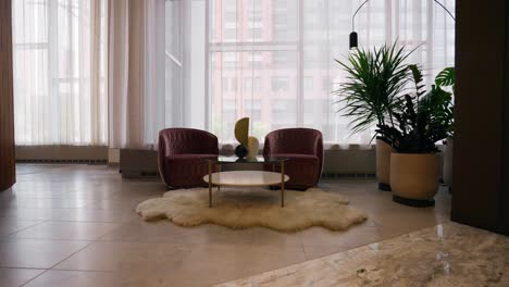 Wide-shot-of-2-unique-chairs-in-a-mid-century-modern-hotel-lobby