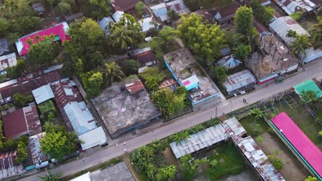 Dense-populated-suburban-slum-community-beside-road