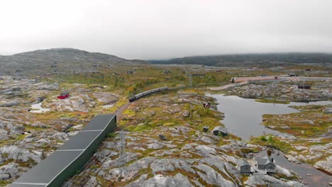 Aerial:-Sweden-arctic-train-entering-a-tunnel-in-northern-Norway