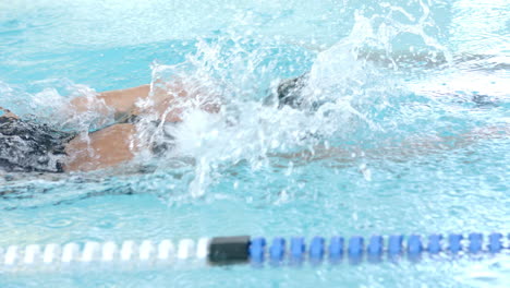 swimmer in action at a pool, with copy space