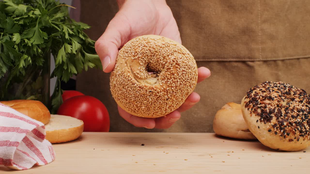 Bagel sandwich brunch, lunch plate of a bagel with smoked salmon and cream cheese and ham, close up morning cafe menu.