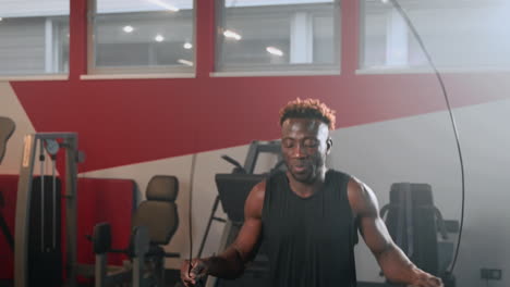 man jumping rope in gym