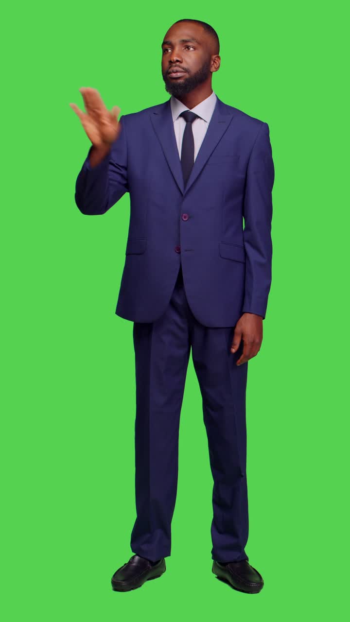 Vertical video: Front view of startup worker analyzing holographic image in studio