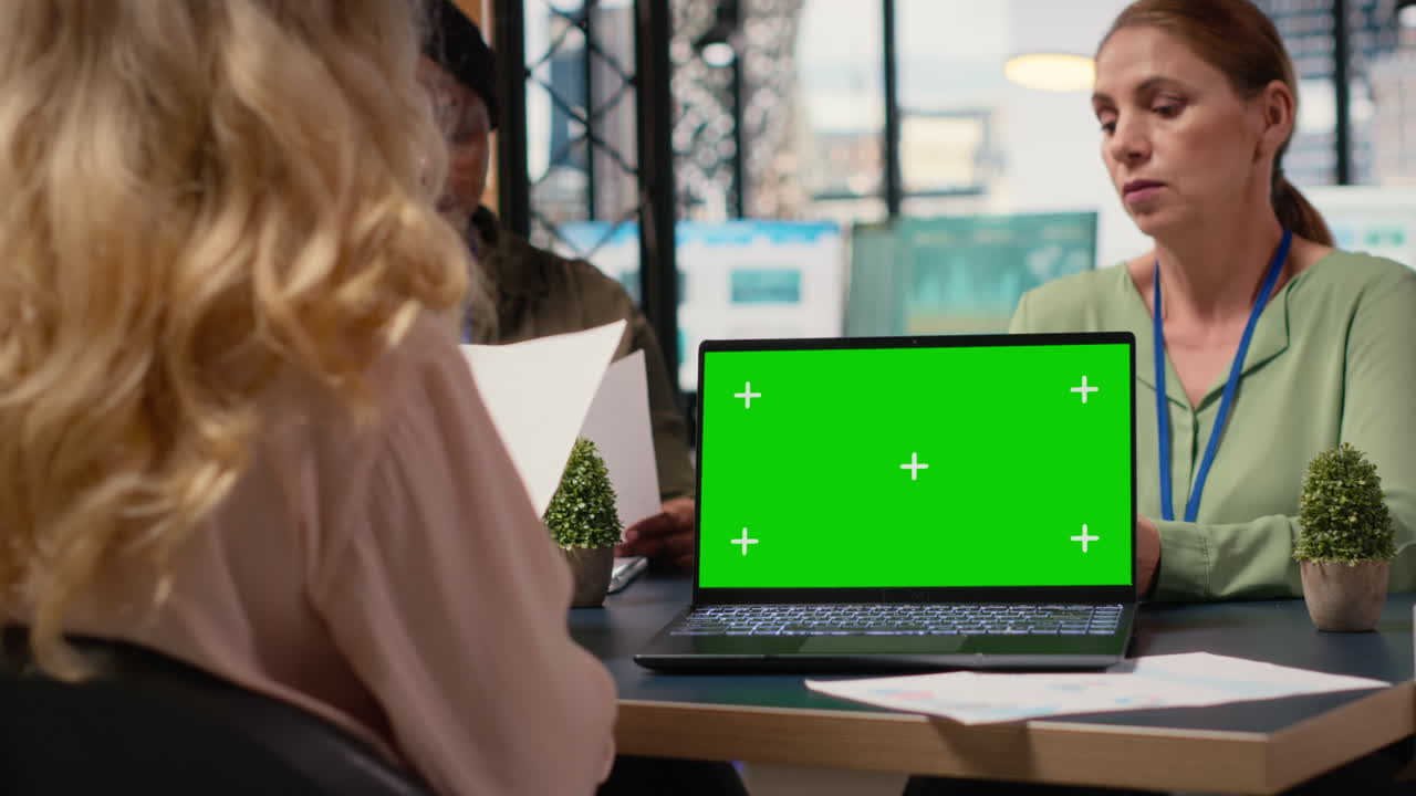 Team of ambitious businesswomen collaborates with copy space screen