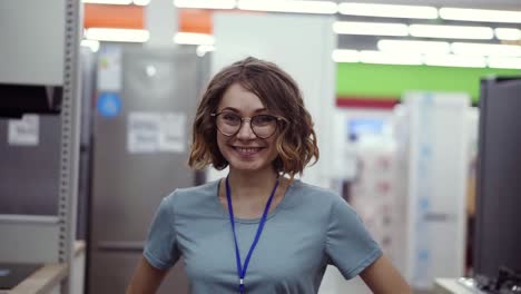 Positive-Female-Seller-Or-Shop-Assistant-Portrait-In-Supermarket-Store-1