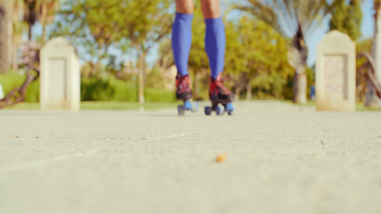 Low Angle Video of a Girl Riding Roller Skates