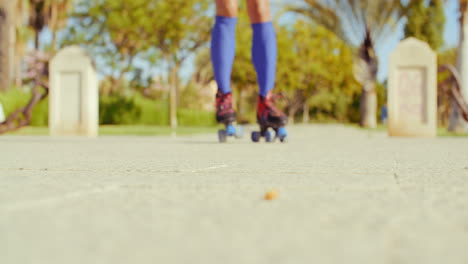 Low-Angle-Video-of-a-Girl-Riding-Roller-Skates