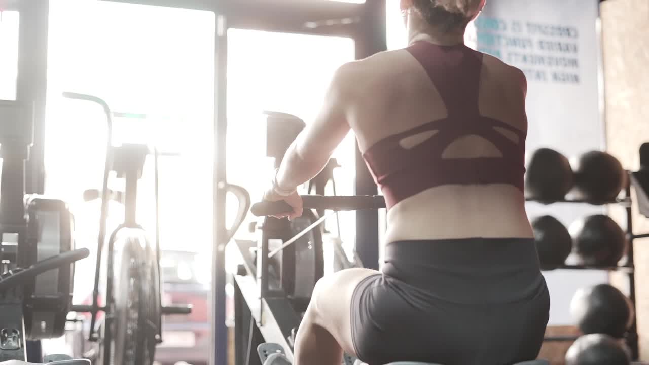 Woman Working Out on Rowing Machine