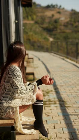 woman enjoying a tea break and a beautiful view