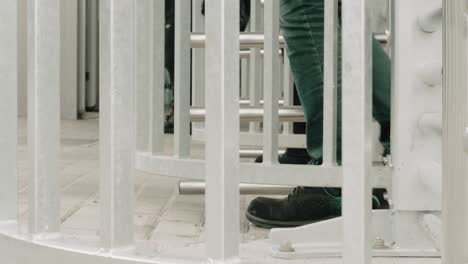 people walking through a revolving gates