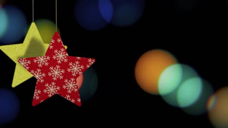 los adornos de las estrellas de navidad se mueven en el fondo de bokeh.