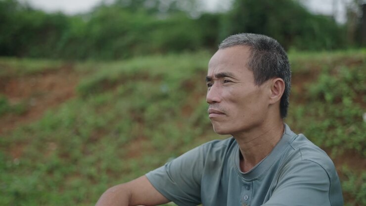 Older Man Sitting Outdoors
