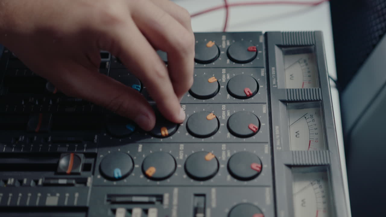 Hands of Musician Using Retro Multitrack Cassette Recorder