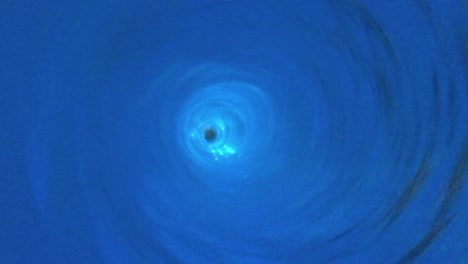 top view of blue water vortex closeup footage