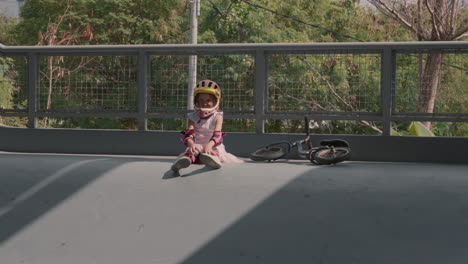 girl resting after riding a bike