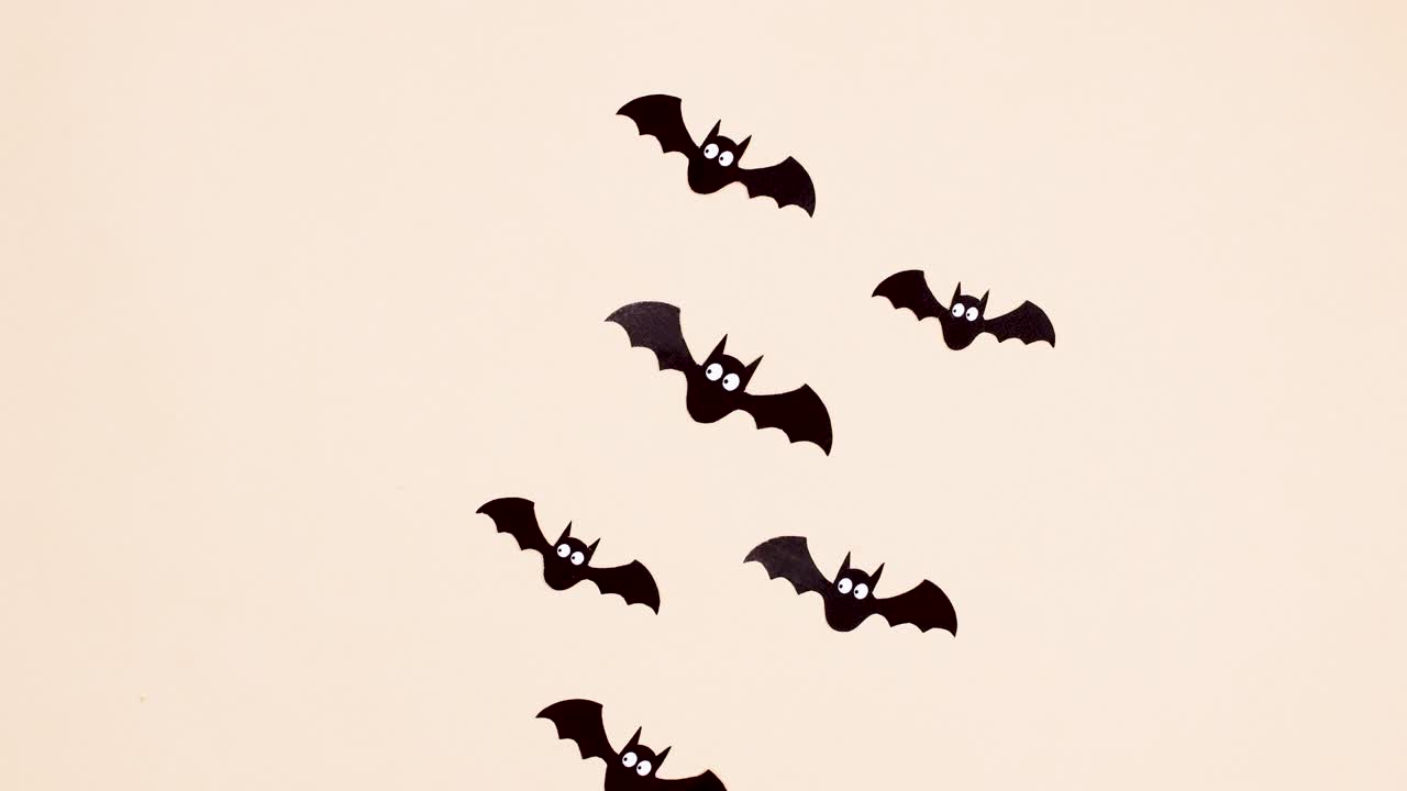Halloween bats fly away. Stop motion