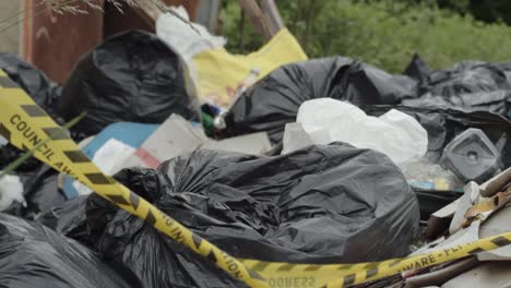 illegal waste and garbage dumped in countryside close up shot