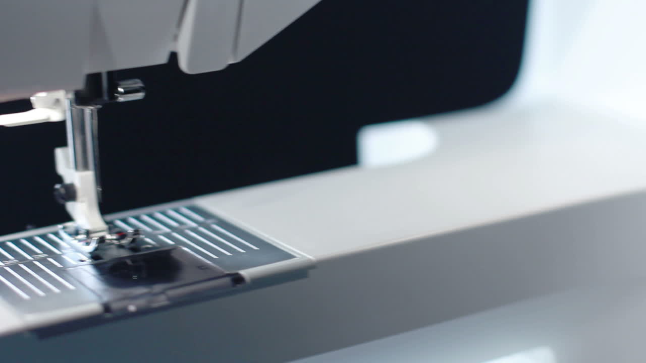 Panning on sewing needle of modern sewing machine. Household equipment