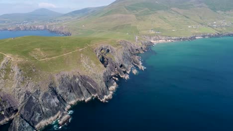 a drone shot of the rugged coastal terrain of the dingle peninsula, near dingle point, in ireland