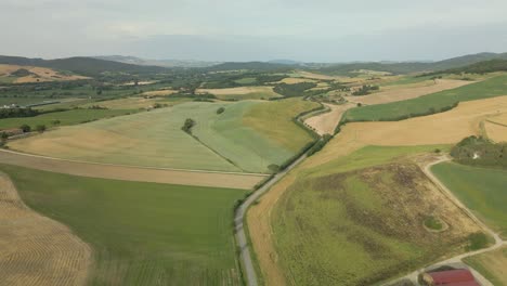 aerial images of tuscany in italy cultivated fields summer