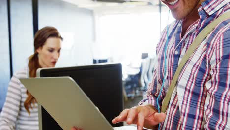 Smiling-man-with-headphone-using-laptop