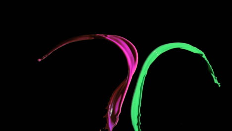 Pink-and-green-paints-in-super-slow-motion-mixing