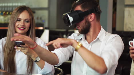 Team-of-developers-working-with-virtual-reality-glasses-during-a-business-meeting.-Young-business-colleagues-brainstorming-using-VR-goggles