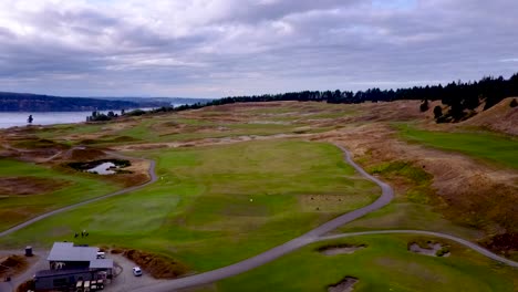 panning aerial of beautiful golf course on the edge of the water