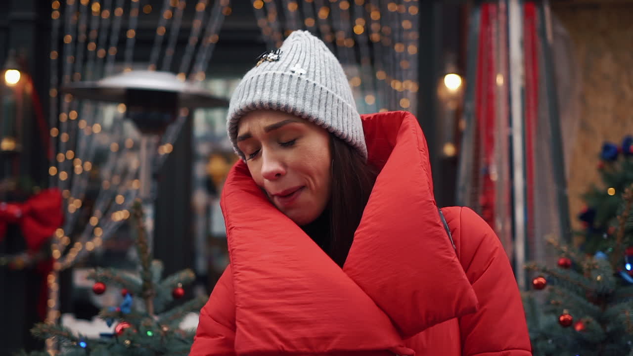 Woman in winter attire outdoors during Christmas