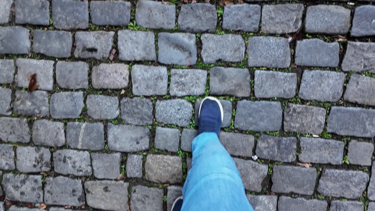 Walking on cobblestone pavement