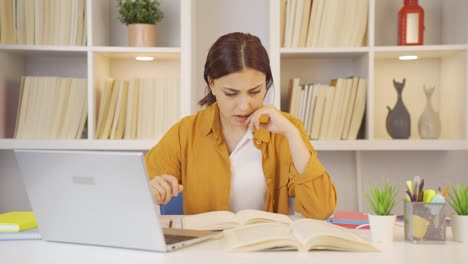 Female-student-stressed-and-biting-her-nails.