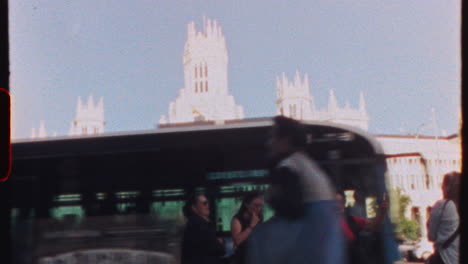 madrid, spain - july 21, 2025: pedestrian traffic flowing near iconic edificio espana at plaza de espana, with locals and tourists moving alongside passing buses and vehicles under bright madrid sunlight