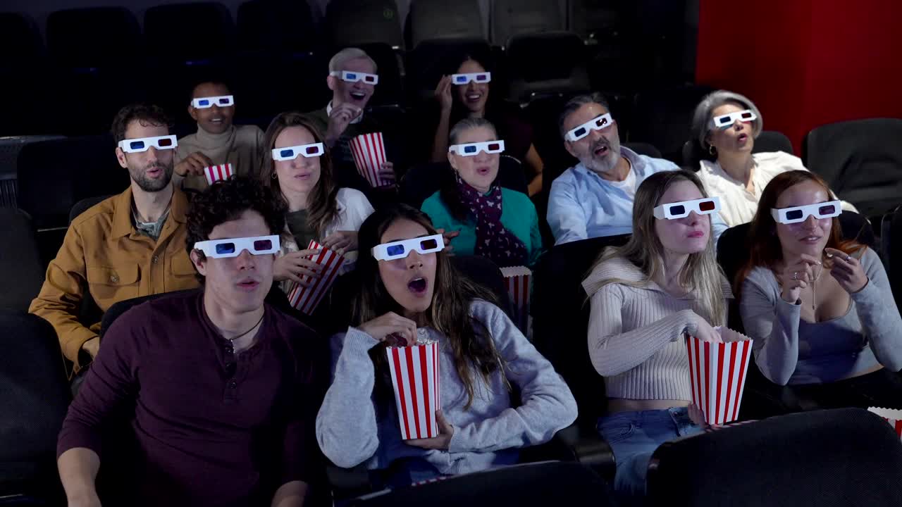 Moviegoers Enjoying a 3D Film with Popcorn