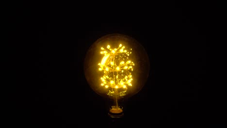 bright ideas light bulb invention or idea concept . symbol of idea. the light comes on on a black background